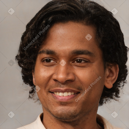 Joyful latino young-adult male with short  brown hair and brown eyes