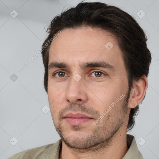 Joyful white adult male with short  brown hair and brown eyes