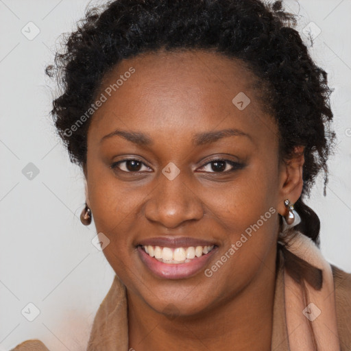 Joyful black young-adult female with long  brown hair and brown eyes