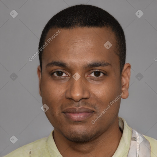Joyful black young-adult male with short  black hair and brown eyes