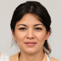 Joyful asian young-adult female with medium  brown hair and brown eyes