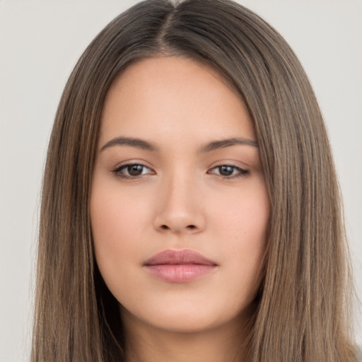 Neutral white young-adult female with long  brown hair and brown eyes