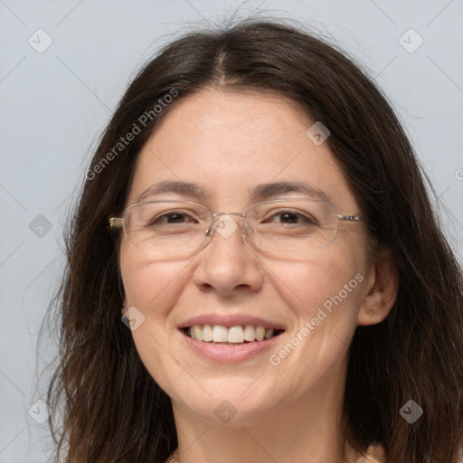 Joyful white adult female with long  brown hair and brown eyes