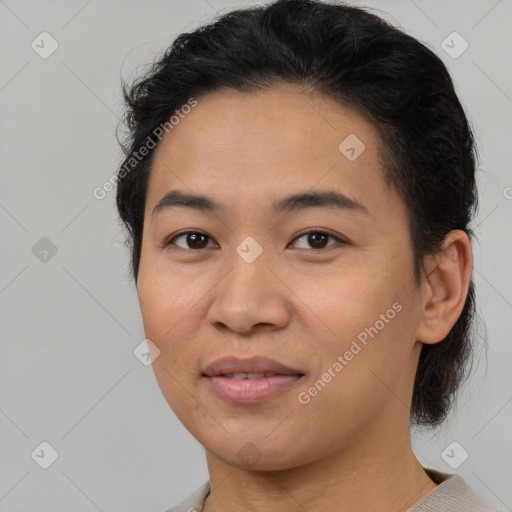 Joyful latino young-adult female with short  brown hair and brown eyes