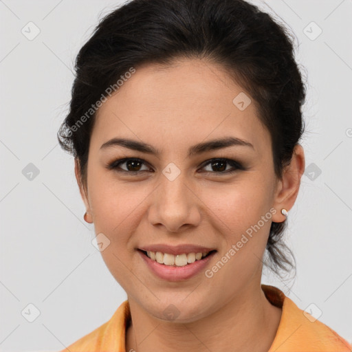 Joyful latino young-adult female with medium  brown hair and brown eyes