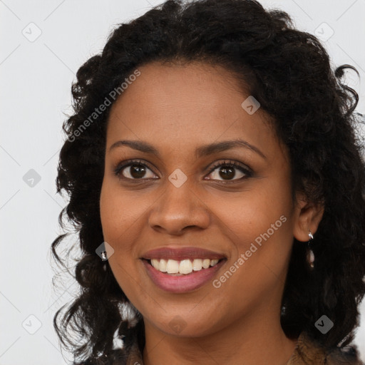 Joyful black young-adult female with long  brown hair and brown eyes