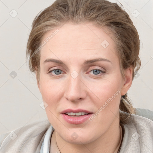 Joyful white young-adult female with medium  brown hair and blue eyes