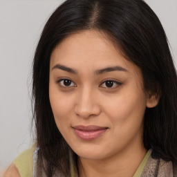 Joyful latino young-adult female with long  brown hair and brown eyes