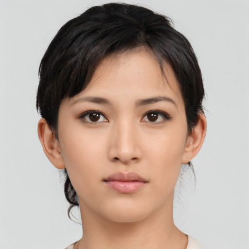 Neutral asian young-adult female with medium  black hair and brown eyes