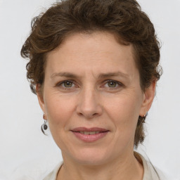 Joyful white adult female with short  brown hair and brown eyes