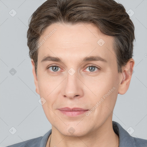 Joyful white adult male with short  brown hair and grey eyes