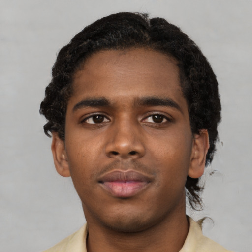 Neutral black young-adult male with short  black hair and brown eyes