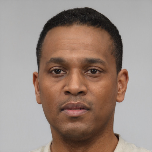 Neutral black young-adult male with short  black hair and brown eyes