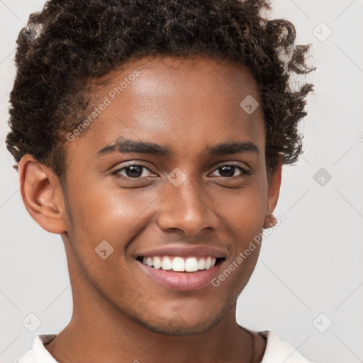 Joyful black young-adult male with short  brown hair and brown eyes