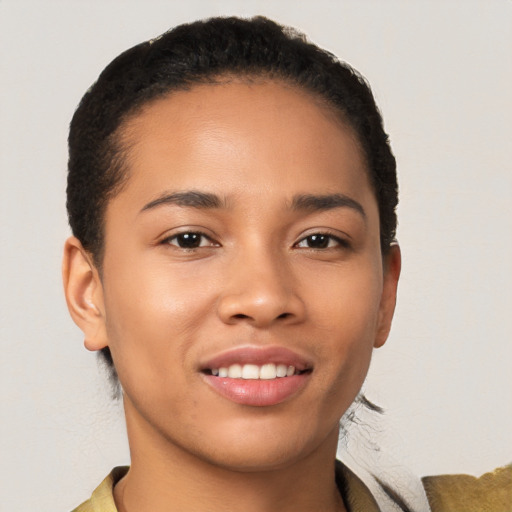 Joyful latino young-adult female with short  brown hair and brown eyes