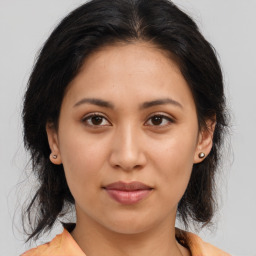 Joyful asian young-adult female with medium  brown hair and brown eyes