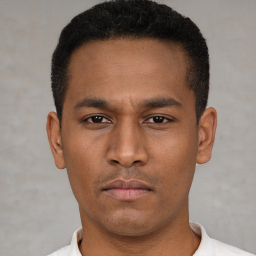 Neutral latino young-adult male with short  black hair and brown eyes