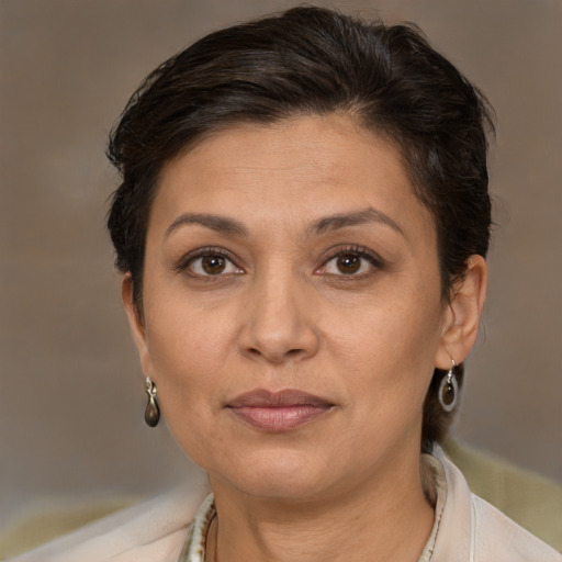 Joyful white adult female with short  brown hair and brown eyes