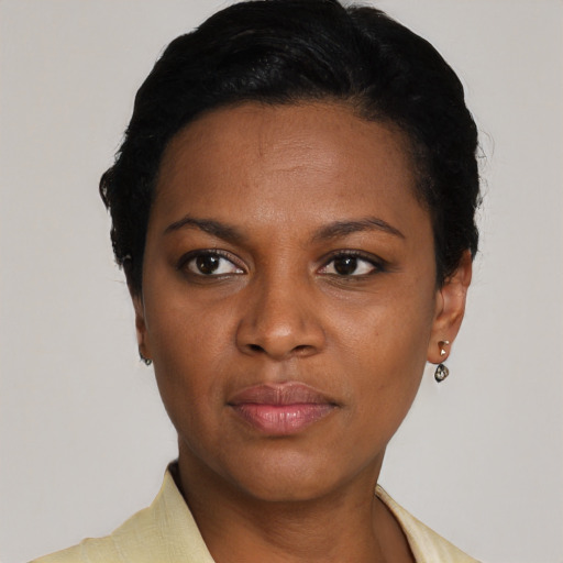 Neutral black young-adult female with short  black hair and brown eyes