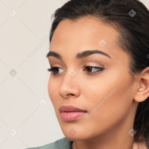 Joyful latino young-adult female with long  brown hair and brown eyes