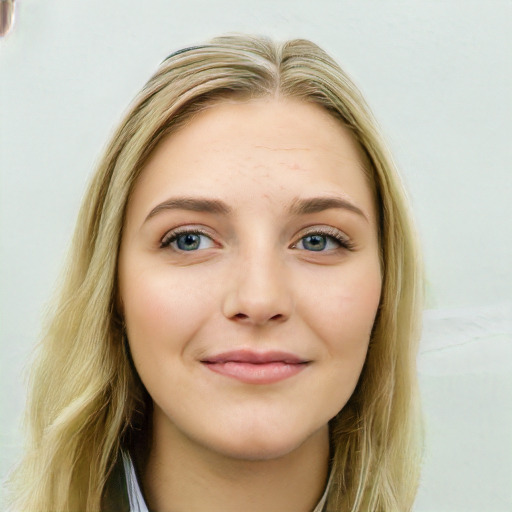 Joyful white young-adult female with long  brown hair and blue eyes