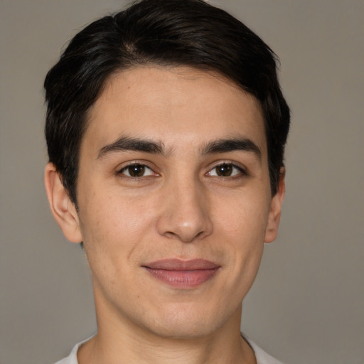 Joyful white young-adult male with short  brown hair and brown eyes