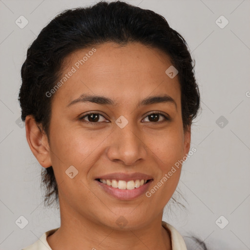 Joyful latino young-adult female with short  brown hair and brown eyes