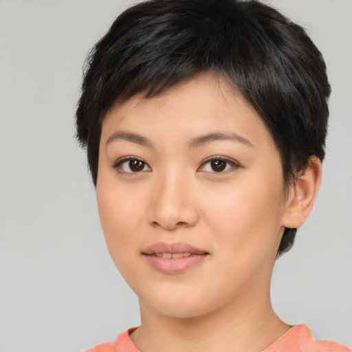 Joyful asian young-adult female with short  brown hair and brown eyes