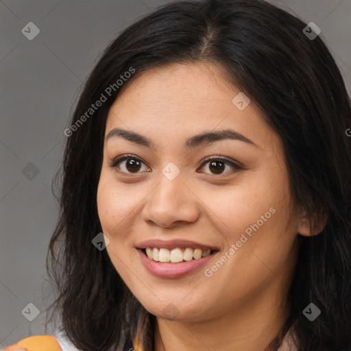 Joyful asian young-adult female with long  brown hair and brown eyes