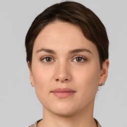 Neutral white young-adult female with short  brown hair and brown eyes