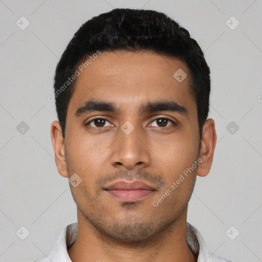 Neutral latino young-adult male with short  black hair and brown eyes