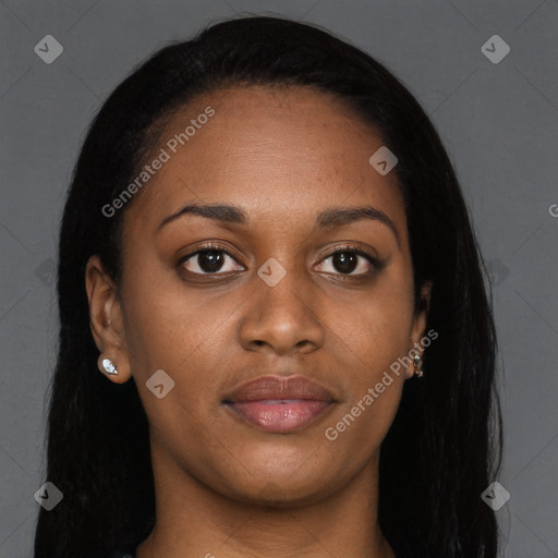 Joyful black young-adult female with long  brown hair and brown eyes