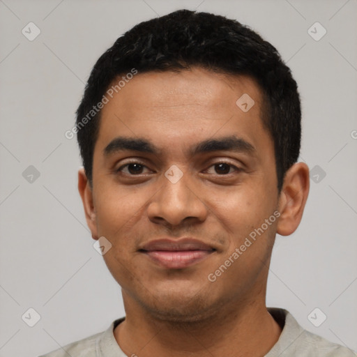 Joyful latino young-adult male with short  black hair and brown eyes