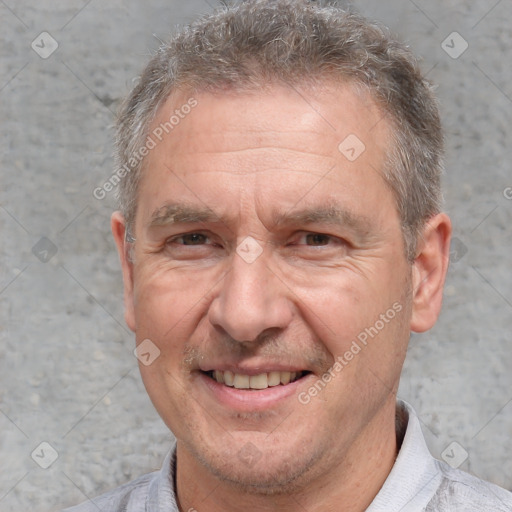 Joyful white middle-aged male with short  brown hair and brown eyes