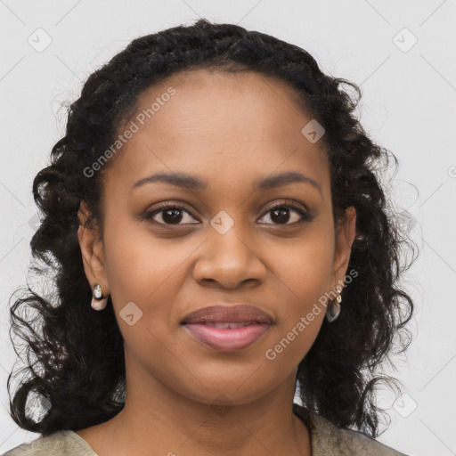 Joyful black young-adult female with long  black hair and brown eyes