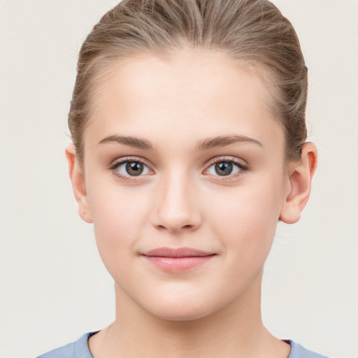 Joyful white child female with medium  brown hair and brown eyes