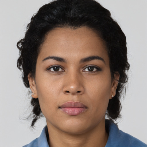 Neutral latino young-adult female with medium  black hair and brown eyes