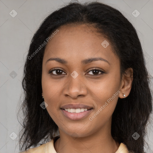 Joyful black young-adult female with long  brown hair and brown eyes