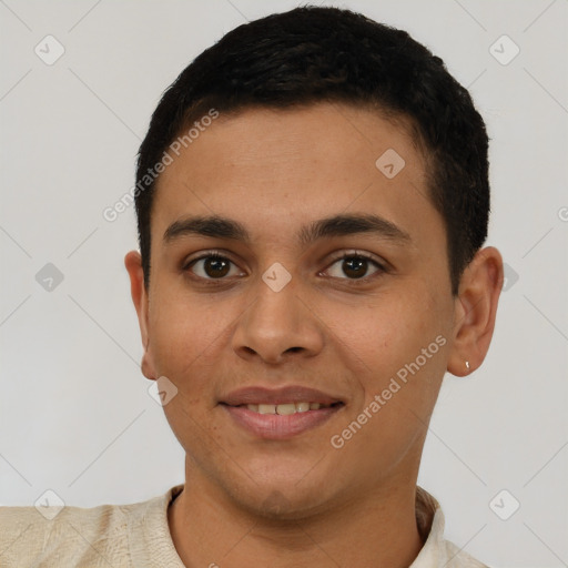 Joyful latino young-adult male with short  brown hair and brown eyes