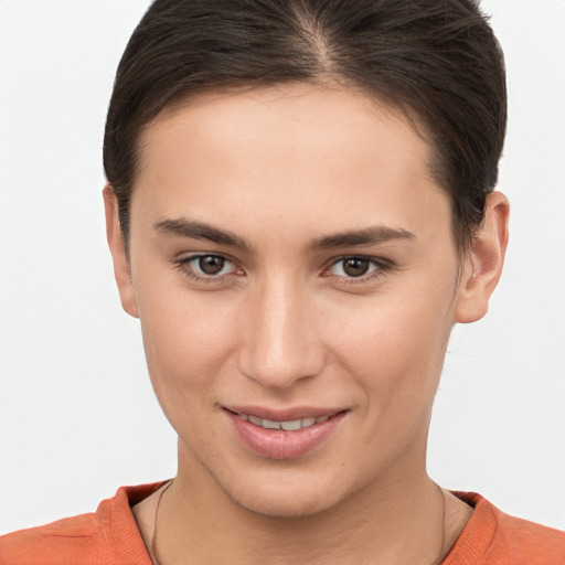 Joyful white young-adult female with short  brown hair and brown eyes