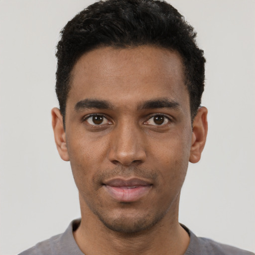 Neutral black young-adult male with short  black hair and brown eyes