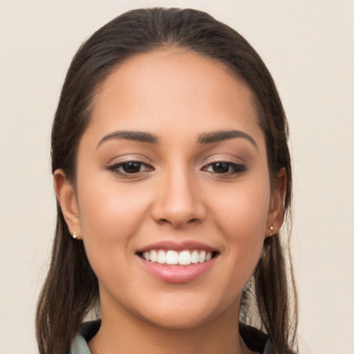 Joyful white young-adult female with long  brown hair and brown eyes