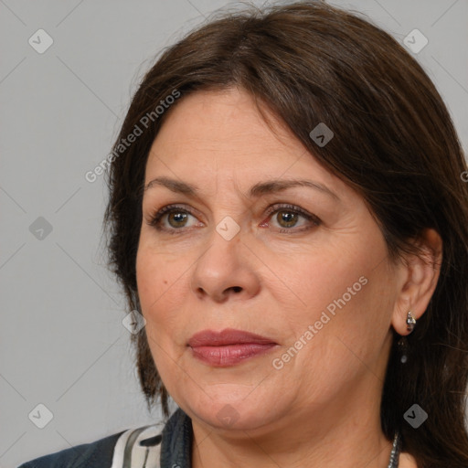 Joyful white adult female with medium  brown hair and brown eyes