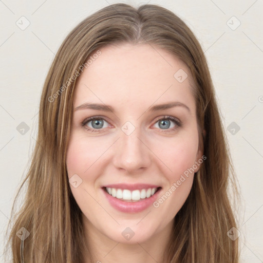 Joyful white young-adult female with long  brown hair and green eyes