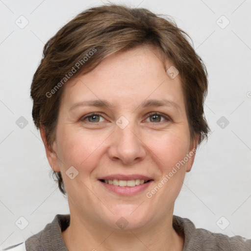 Joyful white adult female with short  brown hair and grey eyes