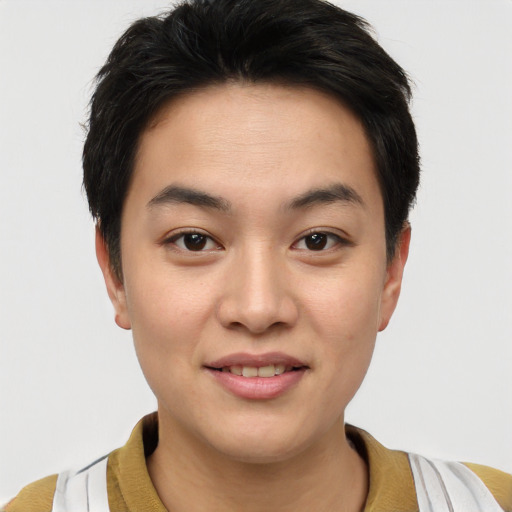 Joyful asian young-adult male with short  brown hair and brown eyes