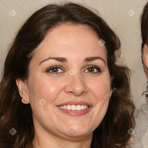 Joyful white adult female with long  brown hair and brown eyes