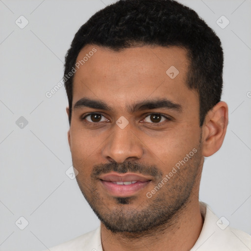 Joyful latino young-adult male with short  black hair and brown eyes