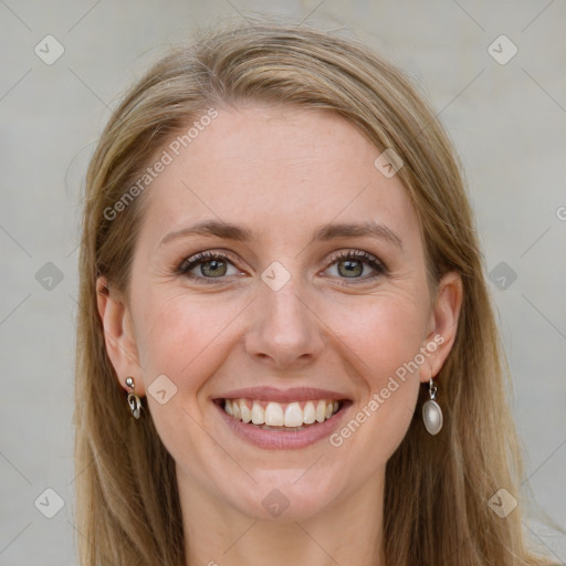 Joyful white young-adult female with long  brown hair and blue eyes