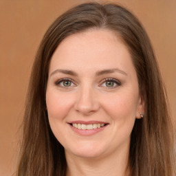 Joyful white young-adult female with long  brown hair and green eyes